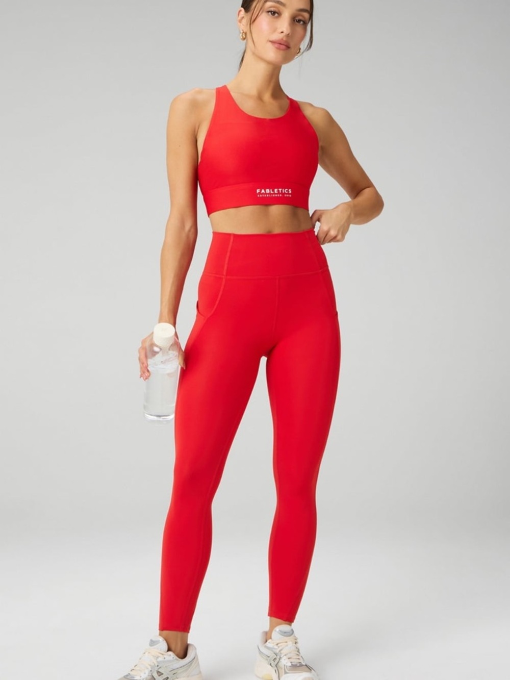 Fabletics Oasis PureLuxe Ladies High-Waisted Leggings in Bright Coral/Heated Red